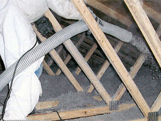 Blown-in cellulose insulation in a residential attic.
